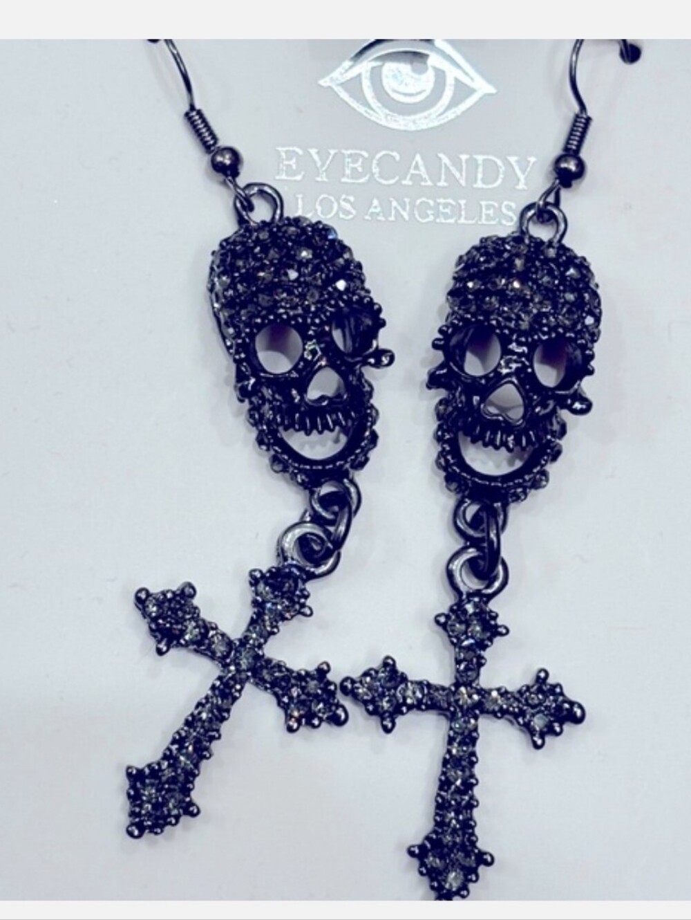 Eye candy scull cross dangle earrings
